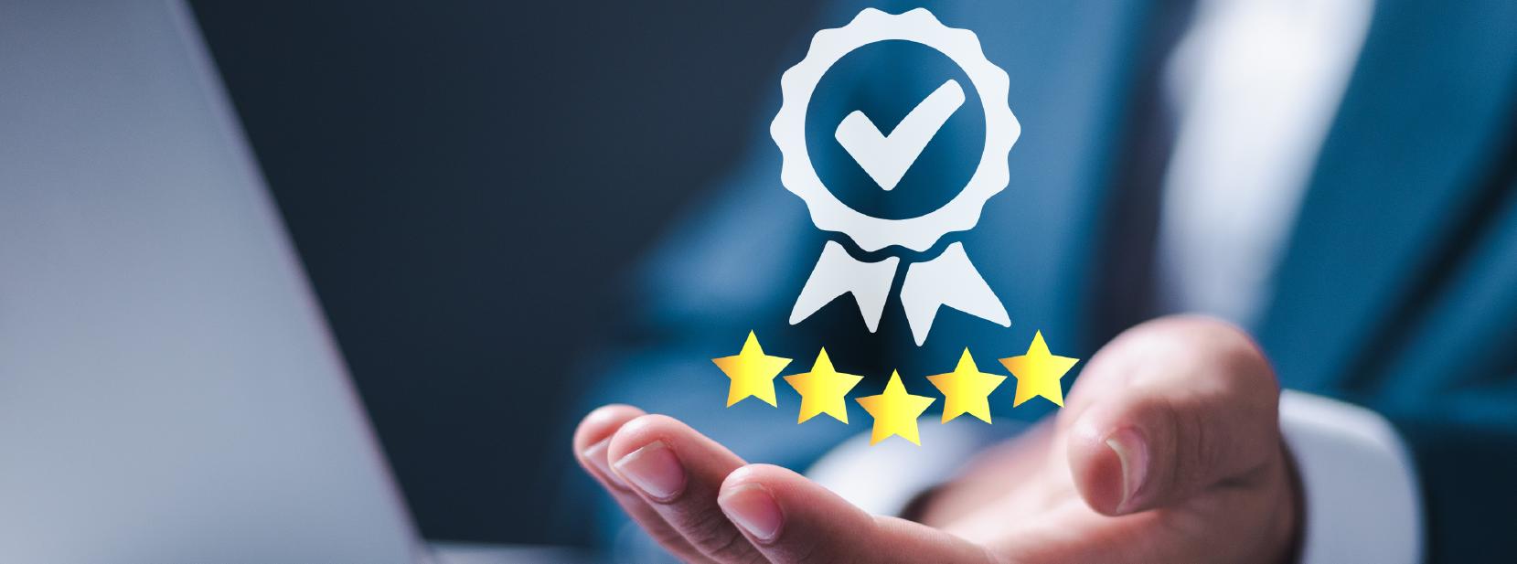 Businessperson holding a holographic icon of a checkmark badge above five gold stars