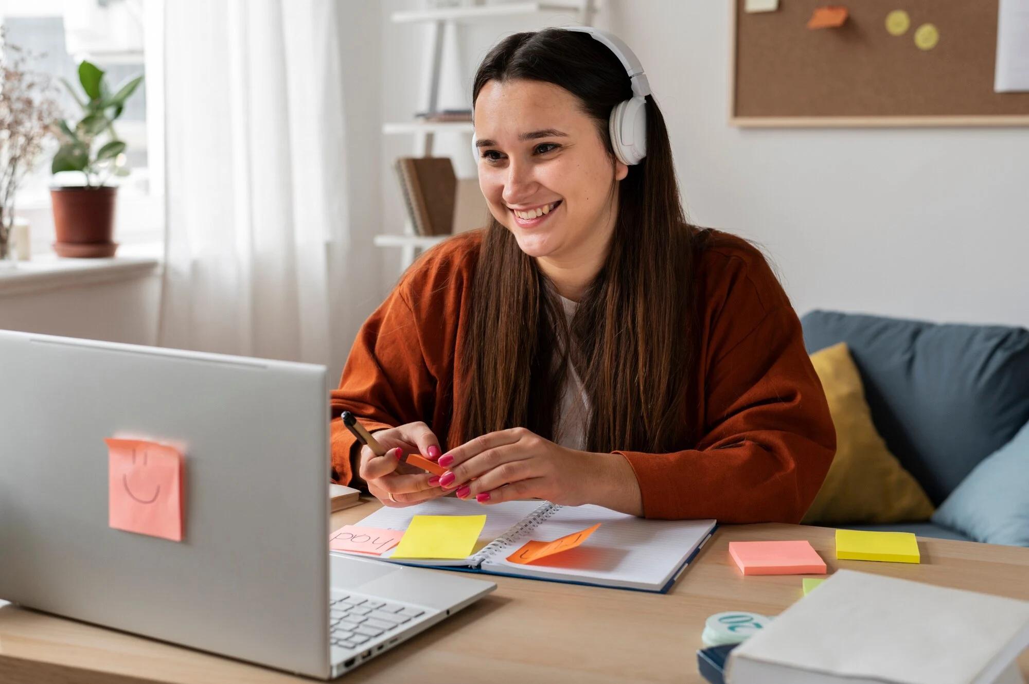 Woman learning online with upGrad’s free certification course on laptop.